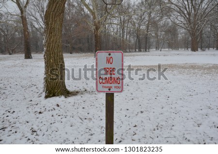 red no tree climbing thank you sign with snow and ice