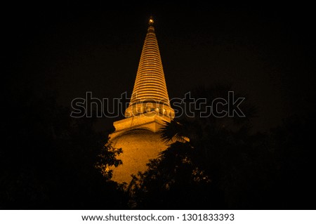 The biggest pagoda with surround silhouette tree at Nakhonpathom Thailand