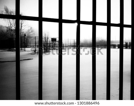 Black snow behind bars in Russia
