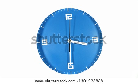 Blue faced clock isolated on white back ground showing time at three thirty