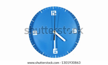 Blue faced clock isolated on white back ground showing time at four thirty am or pm