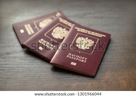 Russian passports close-up on wooden table