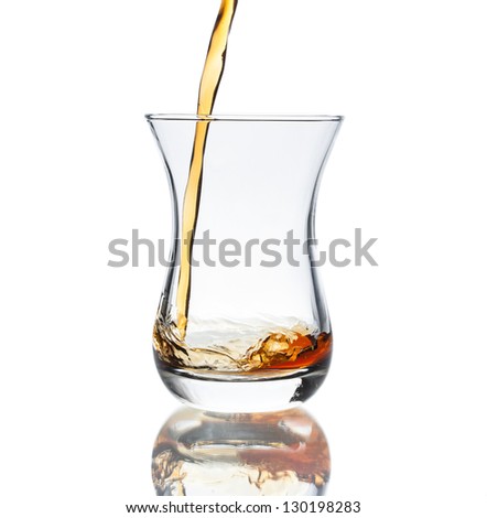 Glass of hot black Turkish tea isolated on white background