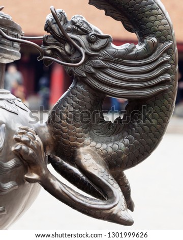 Dragon sculpture in a temple in Hanoi, Vietnam