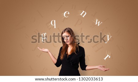 Young student juggle with letters 