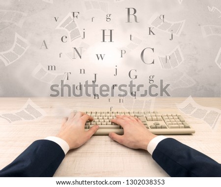 First person view of an elegant businessman hand  typing with fluttering papers around