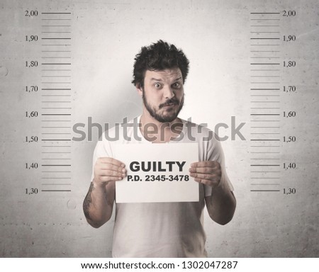 Caught guilty man with ID signs on his hand.