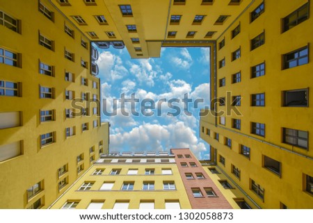Berlin architecture - Beautiful yellow building picture with cloudy sky