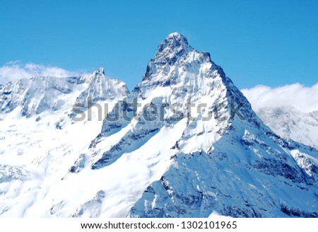 Mountain top in the mountains of Dombai, Caucasus, Russia Royalty-Free Stock Photo #1302101965