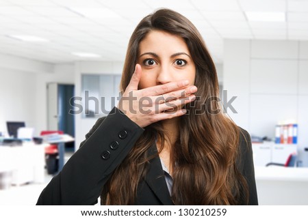 Woman shutting her mouth Royalty-Free Stock Photo #130210259