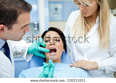 Dentist giving anesthesia his patient