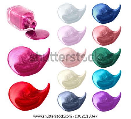 Glossy and metallic finish nail polish smeared blots and bottle, isolated on white background
