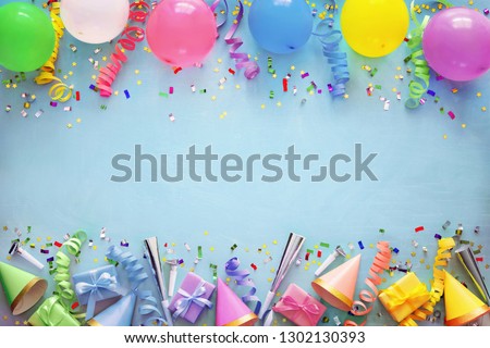 Birthday party decoration with balloons, gift boxes, steamers and confetti