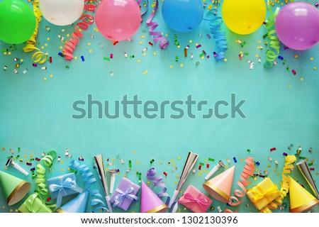 Birthday party decoration with balloons, gift boxes, steamers and confetti