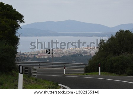 Aerial view of Alghero city from Scala Piccada road.
This road connect Alghero with Villanova Monteleone. Nord Sardinia. Italy.
