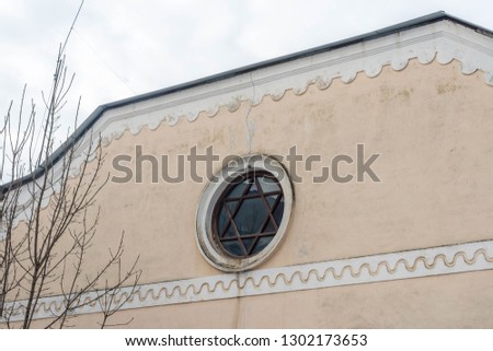Window in the shape of Star of David on a Synagogue in Romania.