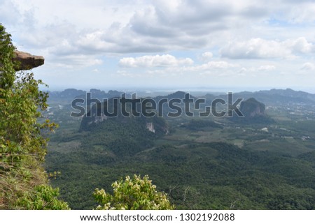 Panorama view with a big rock over Krabi at the jungle hiking trail to dragon crest in Khao Ngon Nak in Krabi, Thailand, Asia Royalty-Free Stock Photo #1302192088
