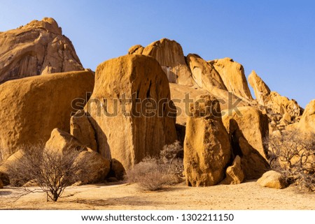 Relaxing behind the rock before the sunset at Spitzkoppe