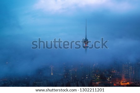 liberation tower under fog in kuwait city 