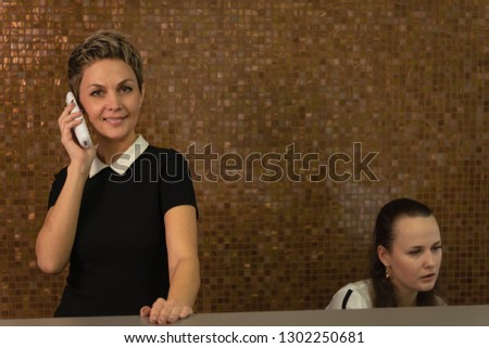 A picture of two receptionists at work