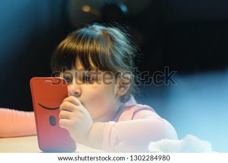 Pretty Caucasian Girl Watching Something On The Smartphone Device While Sitting
