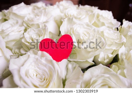 Roses flower bouquet with red heart