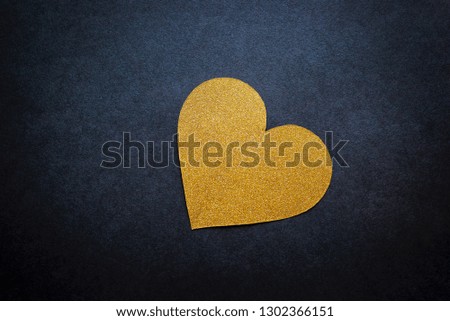 Love hearts on black background. Valentine's day card concept. Golden hearts on black background