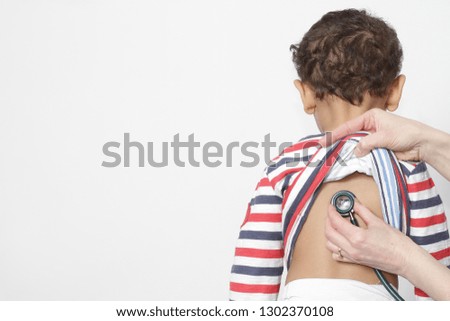little boy with doctor and stethoscope  stock photo