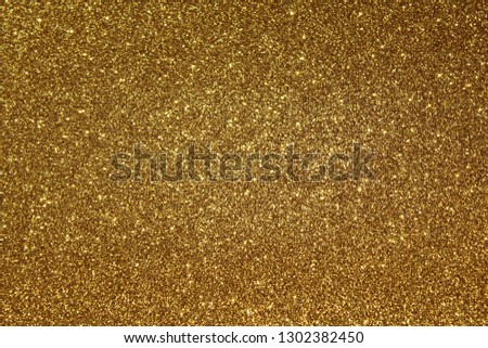 gold glittery background Royalty-Free Stock Photo #1302382450