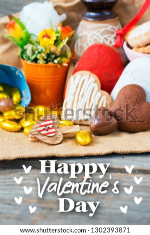 bouquet of flowers in decorative bucket, cookies in shape of heart and romantic decorations.  Happy Valentine's Day card