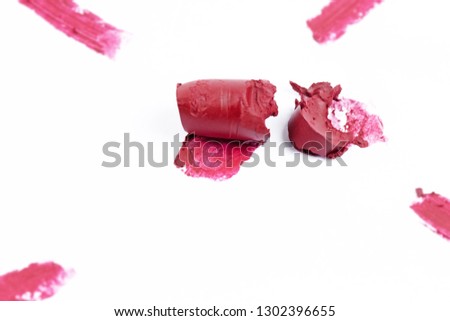 Lipstick smudged on white background,show pigment and texture of color