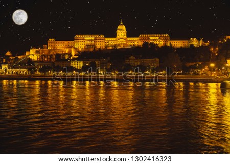  Night Budapes.Capital of Hungary.Beautiful big old town.The photo is made in the dark.The magnificent city is rich in history.City landscape with a wide large river.Beautiful golden city.