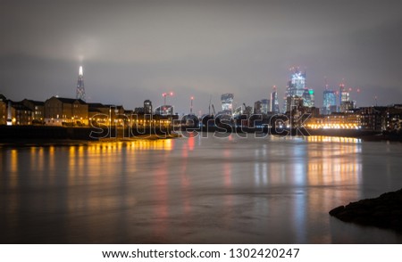 River Thames embankment in the night, Canary wharf, London