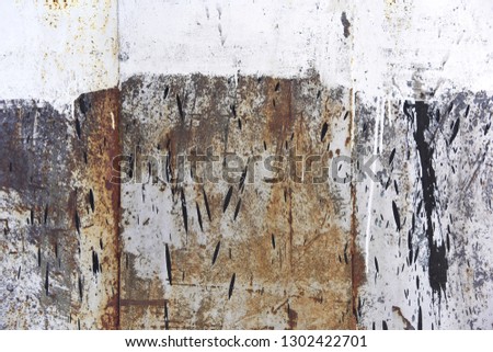 The texture of an old sheet of iron with the remains of light paint. Graphic abstract background.