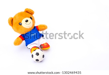 Teddy bear athlete Italy player with ball isolated on white background.