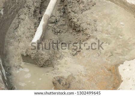 Mixed water and cement 