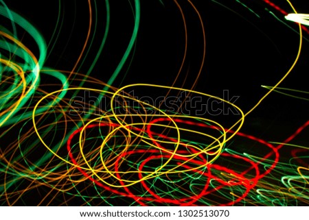 Abstract light painting photography, curves and waves abstract light against a black background