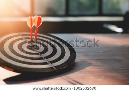 The success is due to the collaboration of a team of business people who are taking towards the goal, Darts rush lace go to target. Royalty-Free Stock Photo #1302532690