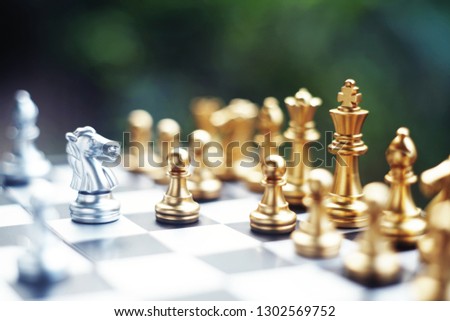 Chess board game. Fighting between silver and golden team. Business competitive and strategy planning concept. Copy space. Royalty-Free Stock Photo #1302569752