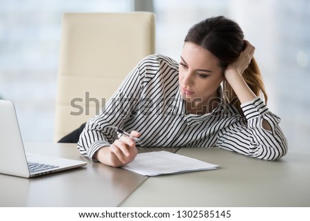 Bored secretary feeling lack of motivation or ideas tired of boring job and dull paperwork, absent-minded lazy female office worker wasting time at workplace unmotivated about monotonous work routine Royalty-Free Stock Photo #1302585145