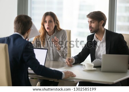 Disgruntled workers or dissatisfied angry clients customers arguing having complaint dispute conflict with lawyer about bad contract demanding fraud compensation negotiating at work office meeting Royalty-Free Stock Photo #1302585199