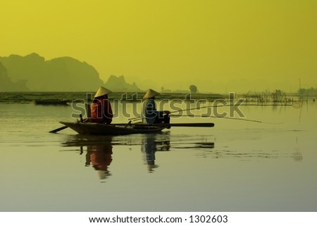 Fisherman working upon sunrise