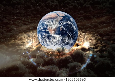 Planet Earth with surrounding clouds, collage. Elements of this image furnished by NASA.