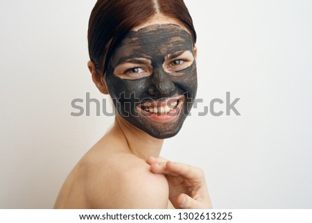 woman smiling on face clay mask portrait