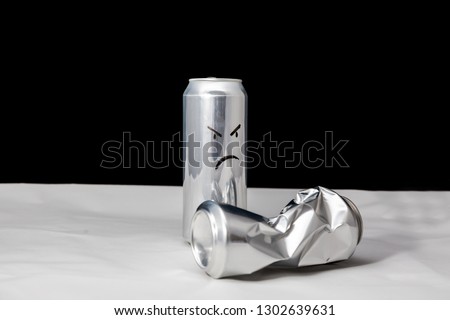 Angry man beat the weak concept. 2 aluminium cans with drawed faces Emoticons emoji 