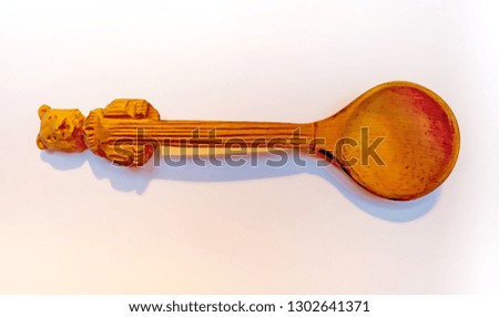 Wooden spoon closeup on white background