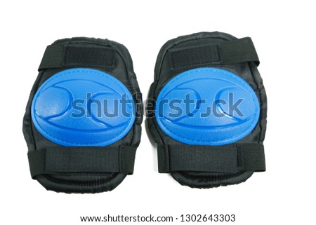 Knee pads and elbow pads isolated on white background Royalty-Free Stock Photo #1302643303