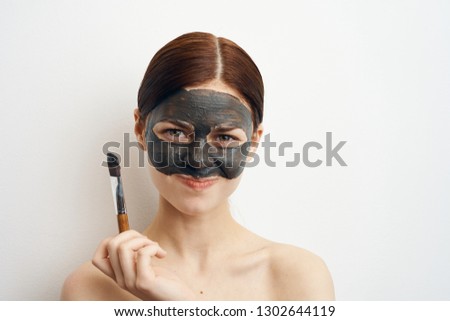 woman in clay mask