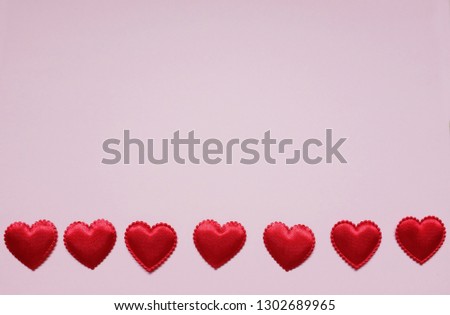 Top view and close up  Many red hearts on a pink background