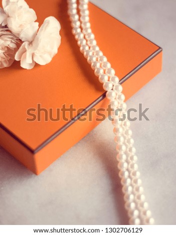 Present box and flowers for her - Mother's day ideas, happy giving and holiday inspiration concept. The perfect gift for mom
